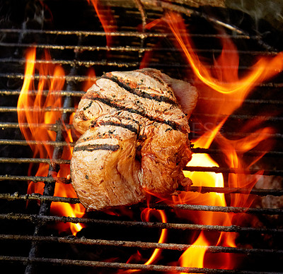 Buy stock photo Closeup of a tasty steak cooking on a fire