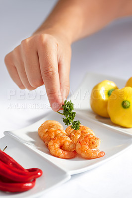 Buy stock photo Hand, prawn and a chef in a restaurant for food serving or luxury hospitality in hotel accommodation. Seafood, shrimp and cooking with a person plating a meal in the kitchen for hunger or nutrition