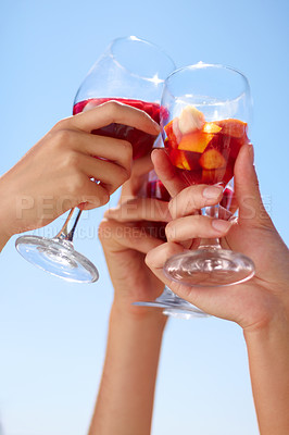 Buy stock photo Hands, cocktail toast and friends outdoor for celebration of friendship together. Alcohol, glass and group cheers to celebrate at summer party, event or social gathering for drinking in low angle.