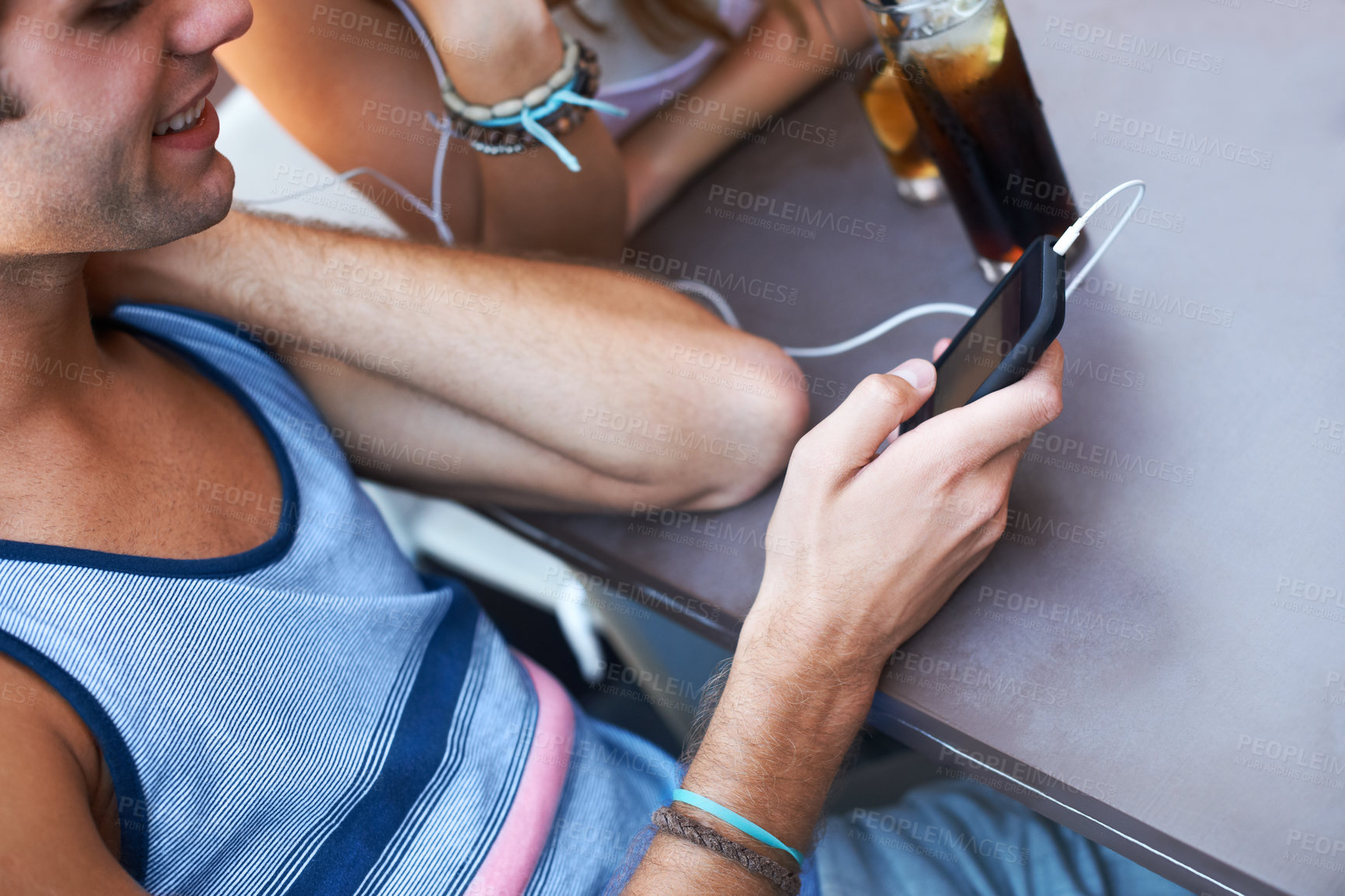 Buy stock photo Smile, cafe and a man with a phone for music, listening to a podcast or watching a video. Happy, social media and a person with a mobile for a radio app, sound or streaming audio at a restaurant