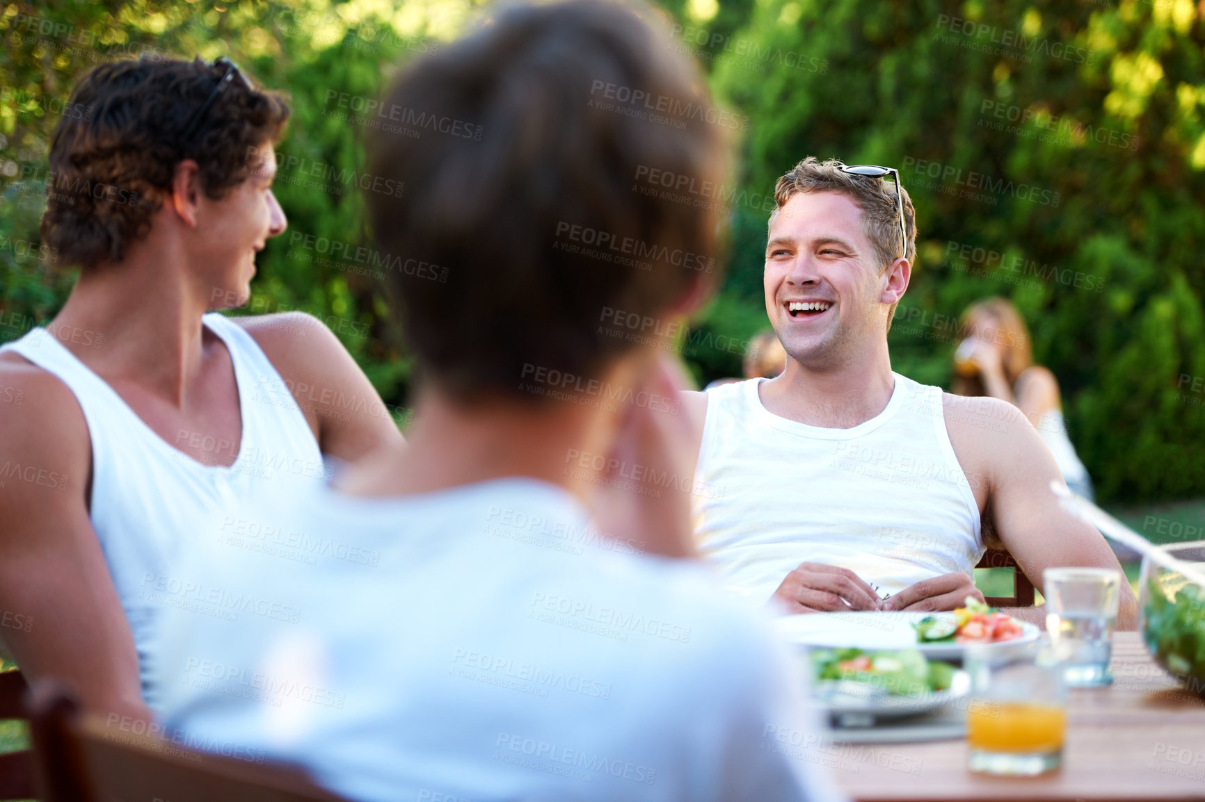 Buy stock photo Friends, laughing and food in backyard for lunch and discussion with a smile with reunion. Salad, talking and young men outdoor of a home with communication and funny joke together with a meal