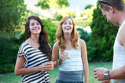 Buy stock photo Happy, friends and drinks in backyard of home with juice, laughing and conversation in garden. BBQ, young people with talking group with smile outdoor with discussion and funny joke ready for summer