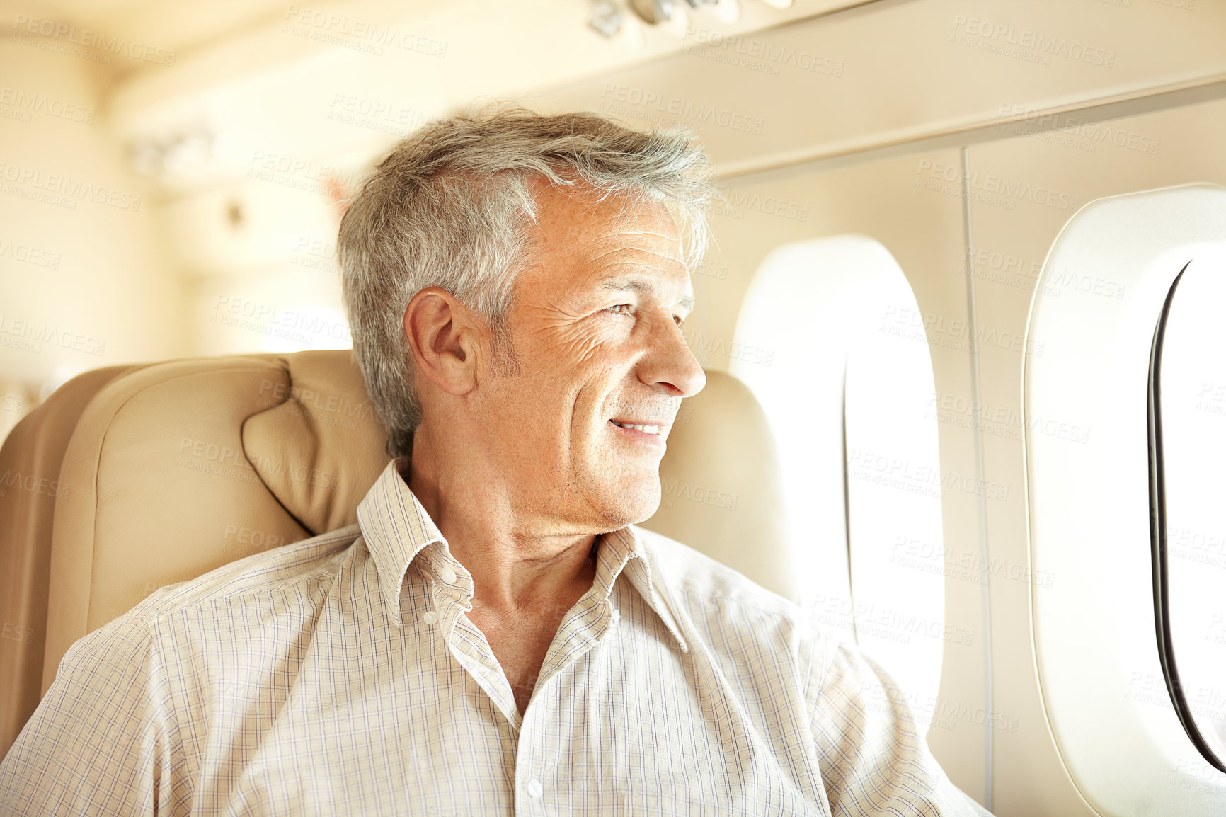 Buy stock photo Senior man in airplane, travel and transportation with flying, window view and vacation with international journey. Private plane, luxury transport and retirement holiday, happy traveller with flight