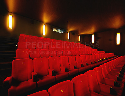Buy stock photo Empty cinema or movie theatre with row of red seats at night before a movie or film theater interior room. Chair in a line with no audience after an event or show in auditorium or opera house