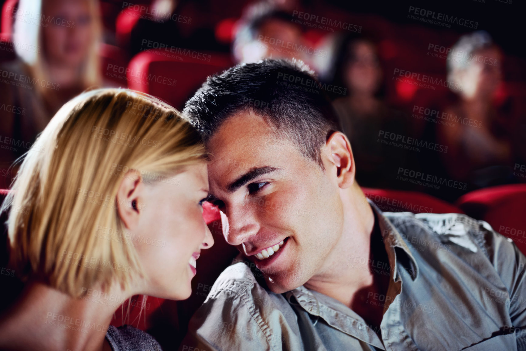 Buy stock photo Cinema, date and happy couple watching movie, smile and romantic night together for show. Theater, man and woman with love, trust and care sitting in auditorium audience to relax at film premier