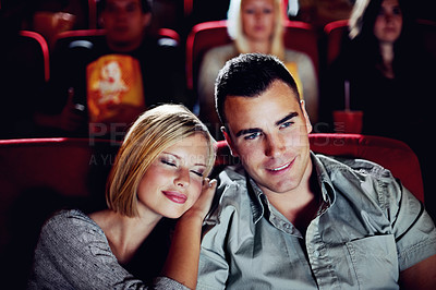 Buy stock photo Cinema, relax and happy couple watching film or show on romantic date together in evening. Movie night, man and woman in theater hall with smile, sleep and sitting in auditorium to relax at premier