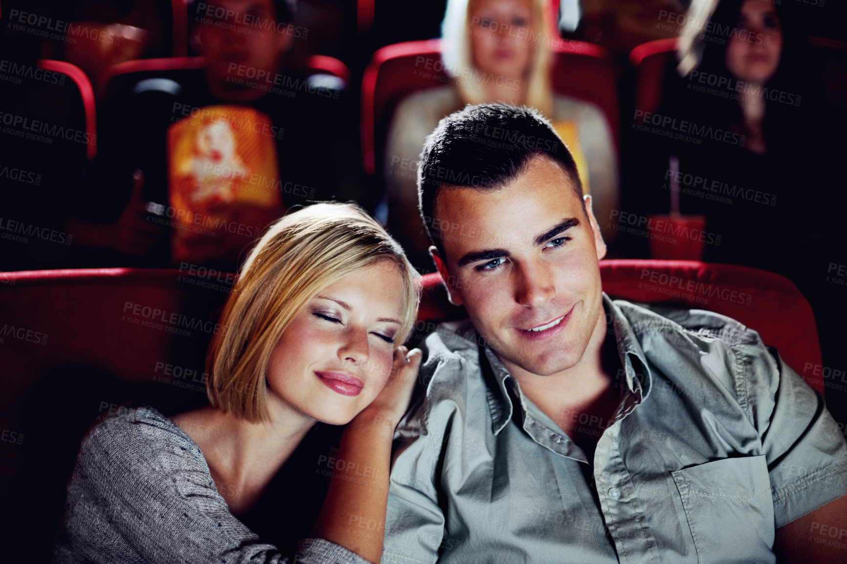 Buy stock photo Cinema, relax and happy couple watching film or show on romantic date together in evening. Movie night, man and woman in theater hall with smile, sleep and sitting in auditorium to relax at premier