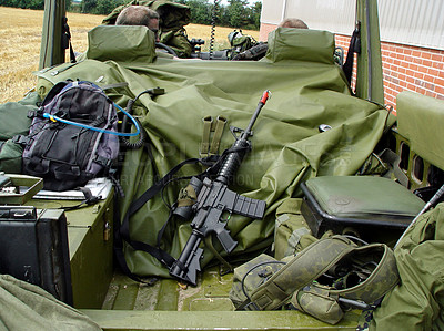 Buy stock photo Soldiers, vehicle and military equipment for mission, objective or outdoor hunt with gun, ammunition or storage. People or army at base with truck for firearm, rifle or supplies ready for rendezvous