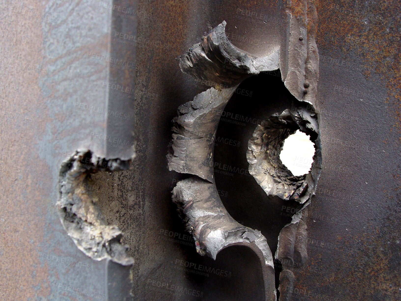 Buy stock photo Closeup bullet hole, the real thing from KFOR, Kosovo 1999. Broken steel and pierced armour are the evidence of a fight, battle or war. Weapons of mass destruction can cause irreparable damage