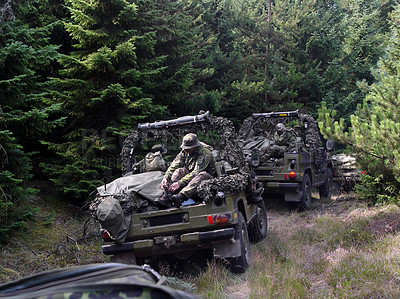 Buy stock photo Shot of a platoon on patrol in the woods - This is the real thing from KFOR, Kosovo 1999. This image is part of our historic collection. The digital cameras available back then where very bad, so expect exceptionally bad image quality