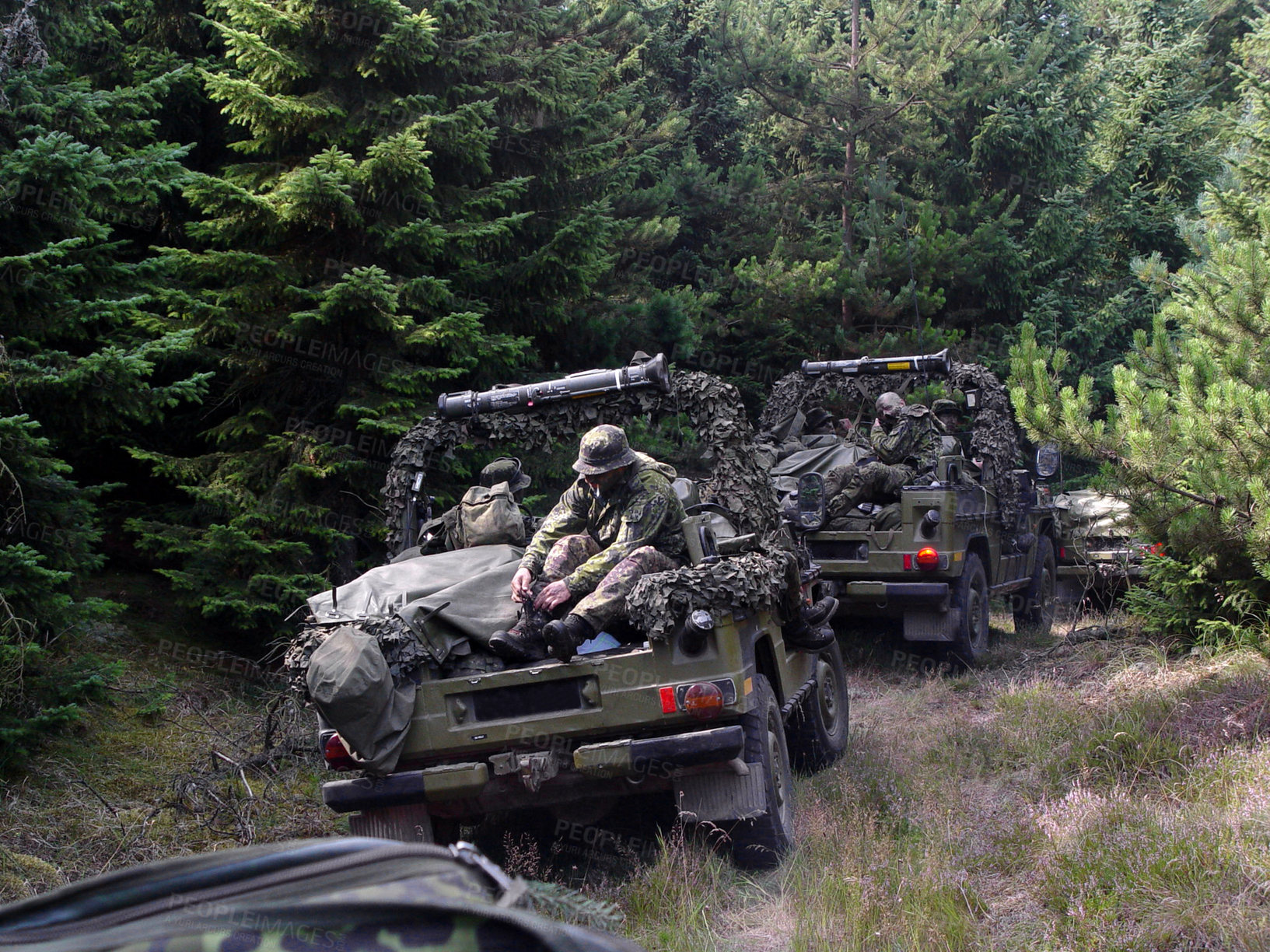 Buy stock photo Shot of a platoon on patrol in the woods - This is the real thing from KFOR, Kosovo 1999. This image is part of our historic collection. The digital cameras available back then where very bad, so expect exceptionally bad image quality