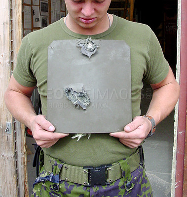 Buy stock photo War, damage and man with bullet proof armor with holes for army or military warzone training. Conflict, metal and closeup of male warrior or soldier with equipment for protection from shooting.