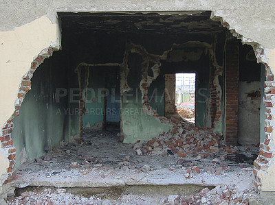 Buy stock photo Building, warzone and destruction of a home during military conflict or turmoil during battle. Hole, damage and wall of a housing structure on a battlefield in Israel or Palestine during war