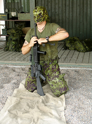 Buy stock photo Army, training to assemble a gun with a man soldier outdoor in camouflage uniform for an exercise. Military, blindfold and a trooper person at bootcamp to build a weapon or rifle in record time