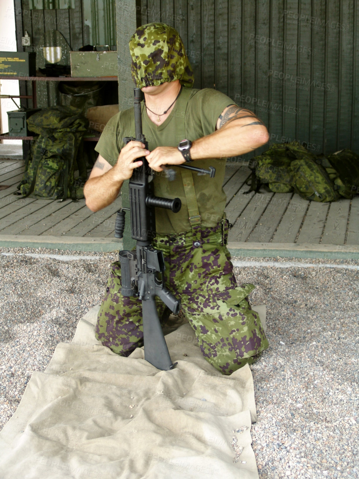 Buy stock photo Army, training to assemble a gun with a man soldier outdoor in camouflage uniform for an exercise. Military, blindfold and a trooper person at bootcamp to build a weapon or rifle in record time