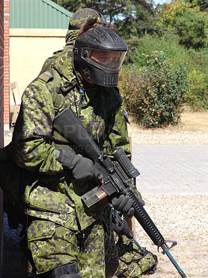 Buy stock photo Soldier, man and target by building with weapon for fitness, exercise or challenge outdoor with gear. Military, person or battle for workout, mission or bootcamp with camouflage or mask for survival