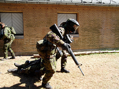 Buy stock photo Army, soldier and mission by building with weapon for fitness, exercise or challenge outdoor with gear. Military, people and running for workout, training or bootcamp with camouflage for survival