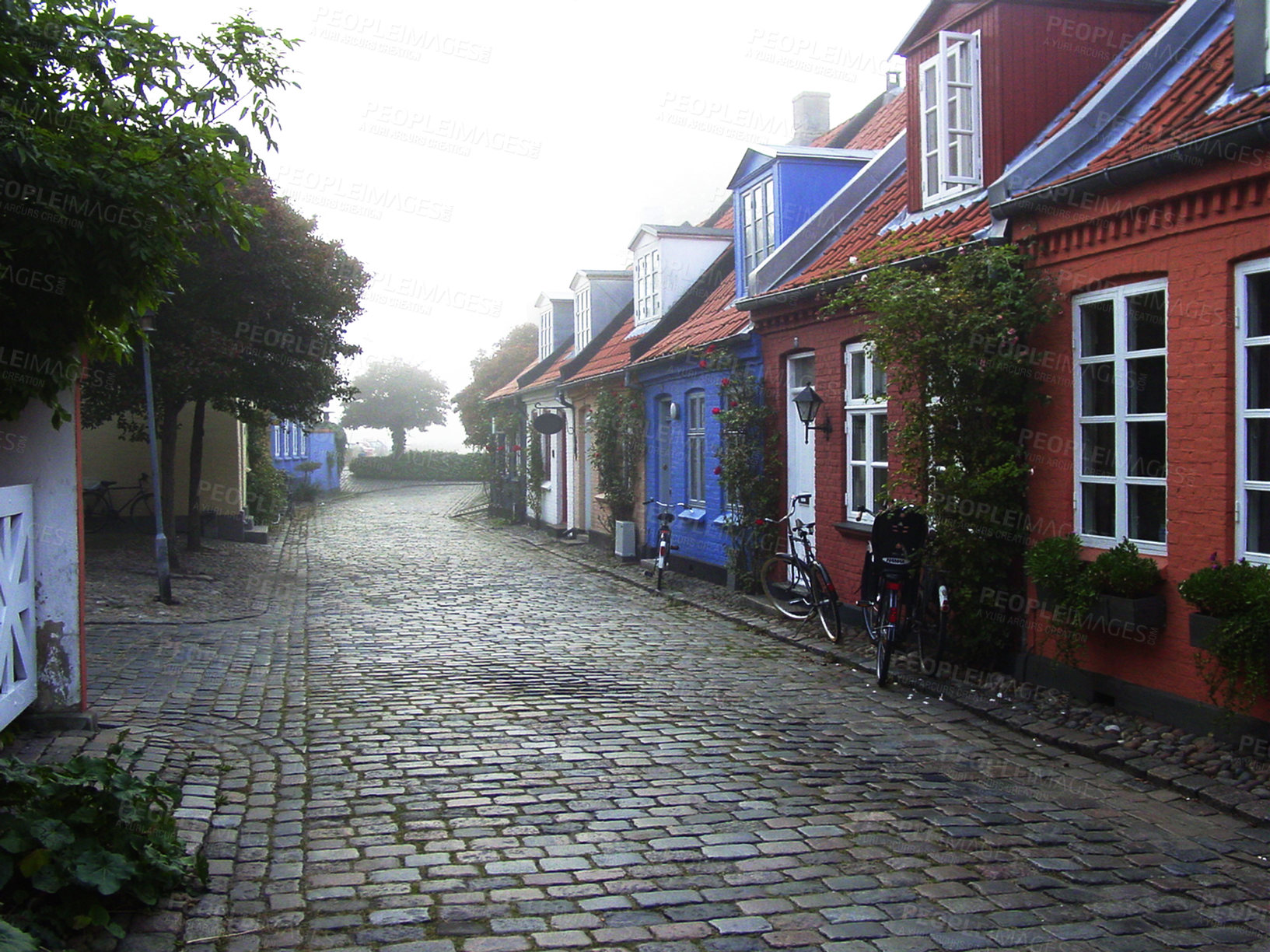 Buy stock photo Cottage, cobblestone road and village, travel and neighborhood in Denmark with landscape or background. Traditional, town and tourism with street, property or houses, architecture and countryside