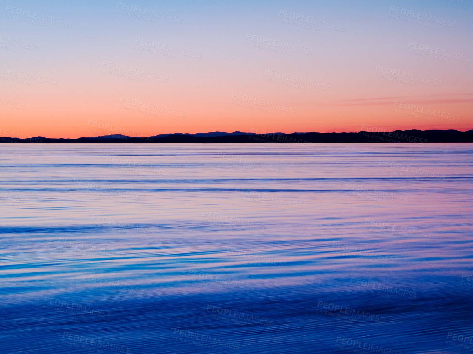 Buy stock photo Sunset on horizon, water and lake outdoor, sky and mockup space in Mediterranean coastline reflection. Sea, ocean and sunrise at seascape at dawn in the morning in nature, calm scenery and summer