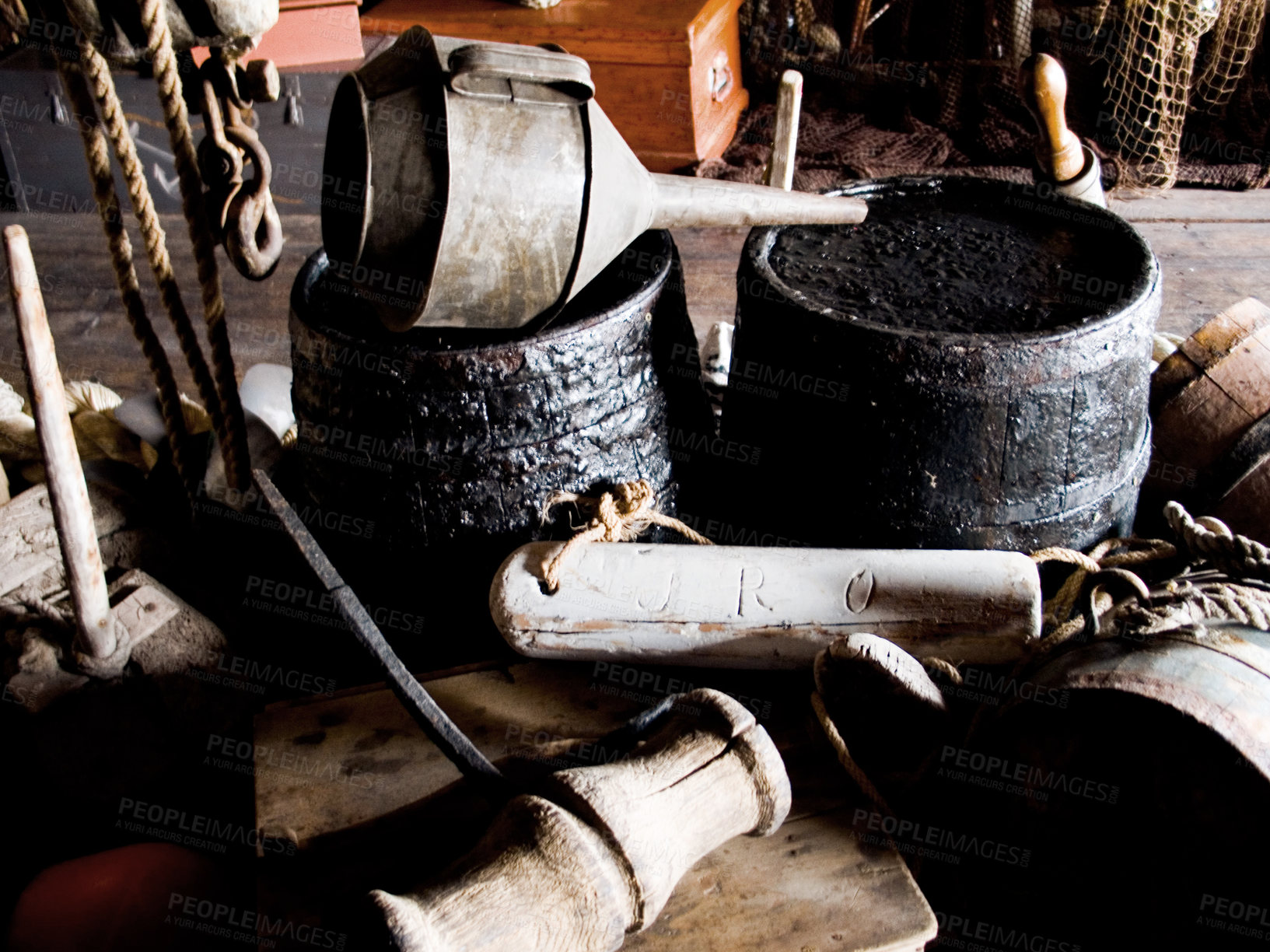 Buy stock photo Interior, cabin and vintage tools, equipment and relics, barrels and bellows for storage of gear. Retro room, rustic cottage and old rope, wood and hammer in house, home and architecture in shack