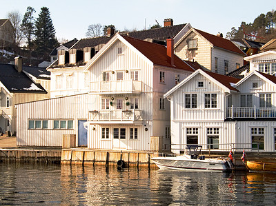 Buy stock photo Facade, water and home by lake in Norway, Europe and boat for tourism, travel or vacation. Exterior, house and Scandinavian building by river, vintage architecture or traditional property real estate