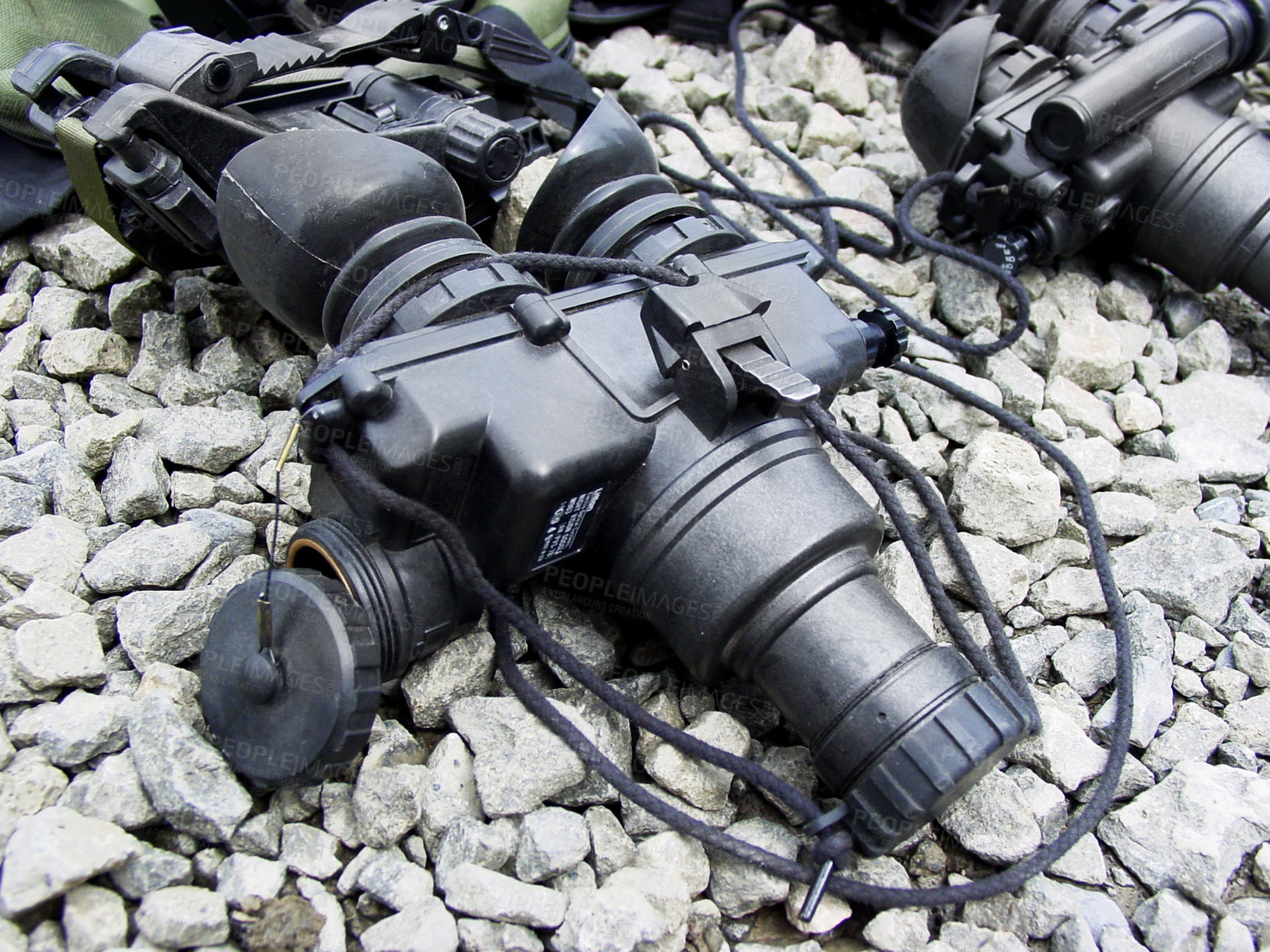 Buy stock photo Night vision goggles, military equipment and surveillance from above for combat training or mission. War, army gadget or glasses for a tactical stealth operation closeup on the ground with stones