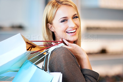 Buy stock photo Customer walking in mall with shopping bag, in designer fashion boutique with smile and happy with sale in retail shop. Portrait of face of rich woman in clothing store and happiness with discount