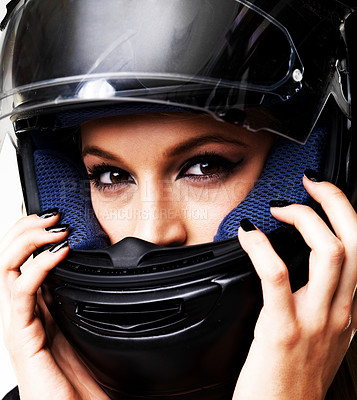 Buy stock photo Wear motorbike helmet, portrait and woman in studio isolated on white background. Biker, serious girl and face for safety, protection and fashion style, racer and driver with hand manicure or makeup