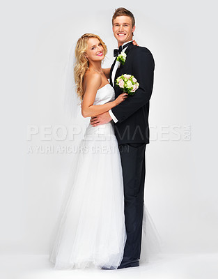 Buy stock photo Portrait of a cute newlywed couple embracing 