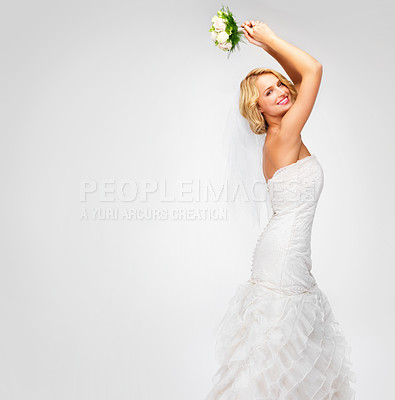 Buy stock photo Gorgeous young bride getting ready to throw her bouquet