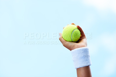 Buy stock photo Tennis, hands and person with ball on blue sky for training, competition performance and fitness contest. Closeup, athlete and sports player ready to serve for action in game, skill and mockup space 