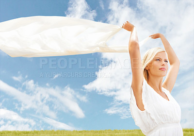 Buy stock photo A beautiful young woman holding a scarf in the breeze