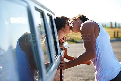 Buy stock photo Kiss, love and a couple on a road trip in a van for a holiday, adventure or a drive. Care, romantic and a man and woman kissing in nature with transportation for a honeymoon vacation or date