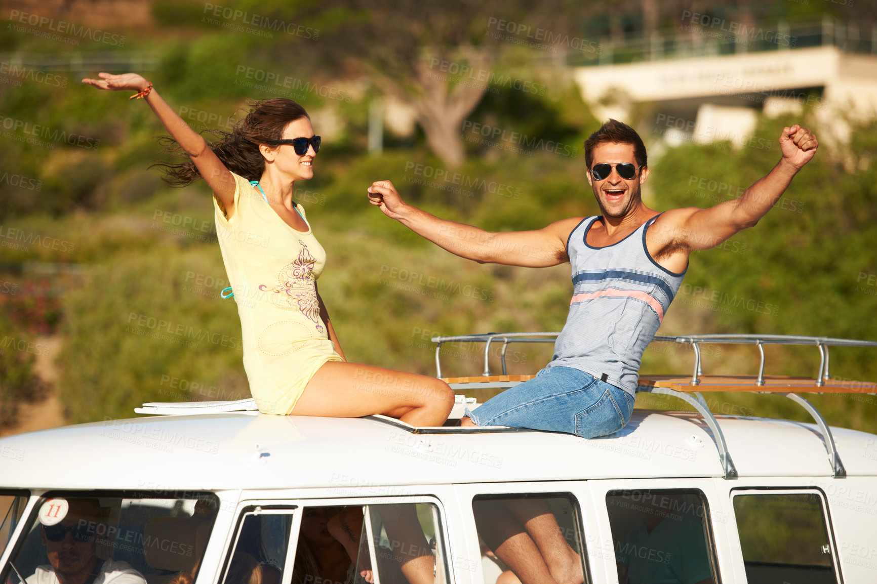 Buy stock photo Excited, travel or happy couple on road trip for holiday or fun summer vacation together to relax. Woman, man or people on roof of van on break or journey adventure for freedom with hands up or smile