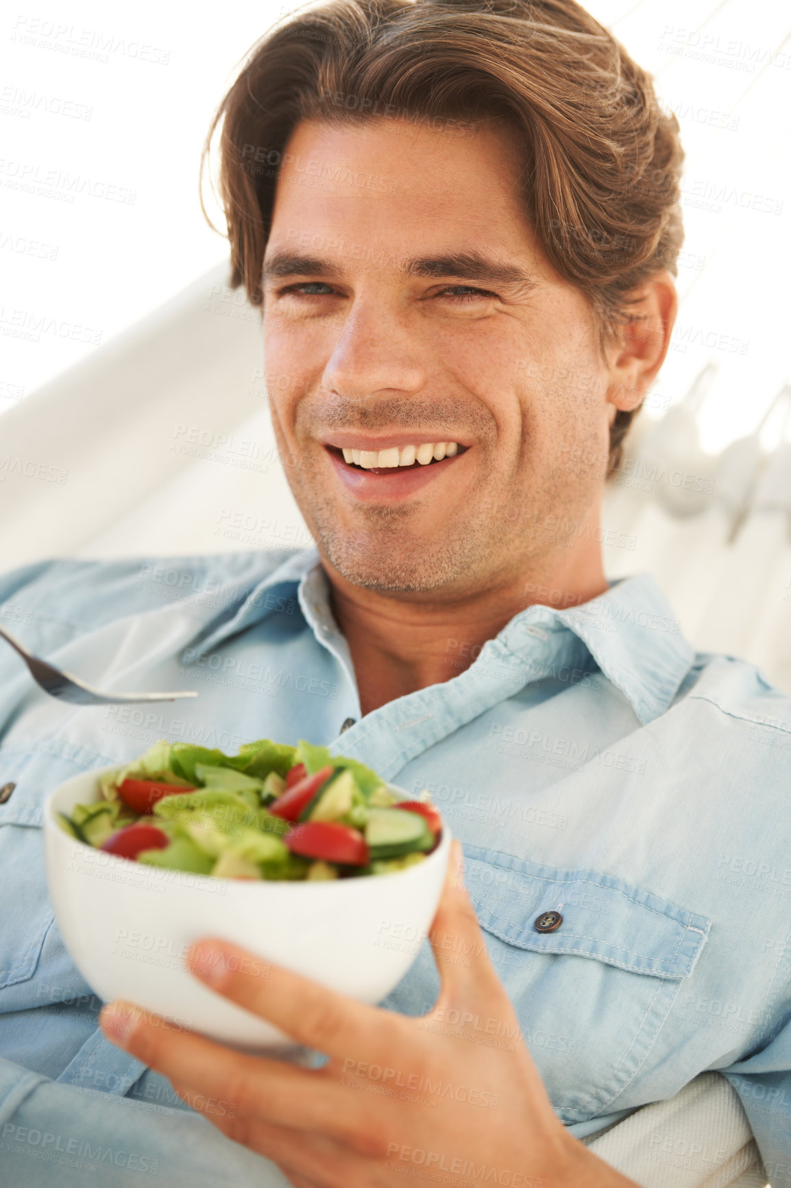 Buy stock photo Portrait, man and smile while eating salad for detox, clean diet and to lose weight at home. Happy guy with bowl of healthy food, nutrition and vegan benefits for digestion, wellness and lunch meal 