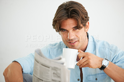 Buy stock photo Newspaper, coffee and portrait of man reading information and relaxing on a weekend morning at home. Happy, smart and male person drinking latte and enjoying a daily paper journal in modern apartment
