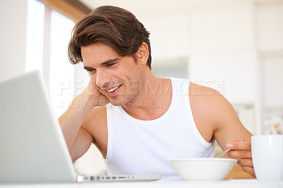 Buy stock photo Laptop, eating and man watching a movie, film or show on streaming website or the internet. Technology, smile and young male person enjoying cereal and video on social media with computer at home.