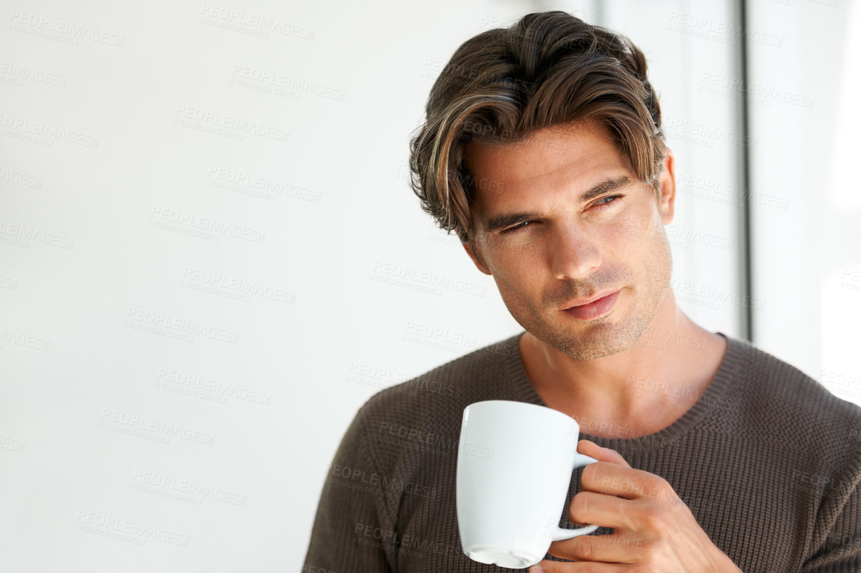 Buy stock photo Coffee, thinking and handsome man at apartment with memory, vision or reflection face expression. Young, morning and male person from Canada with latte, cappuccino or espresso with an idea at home