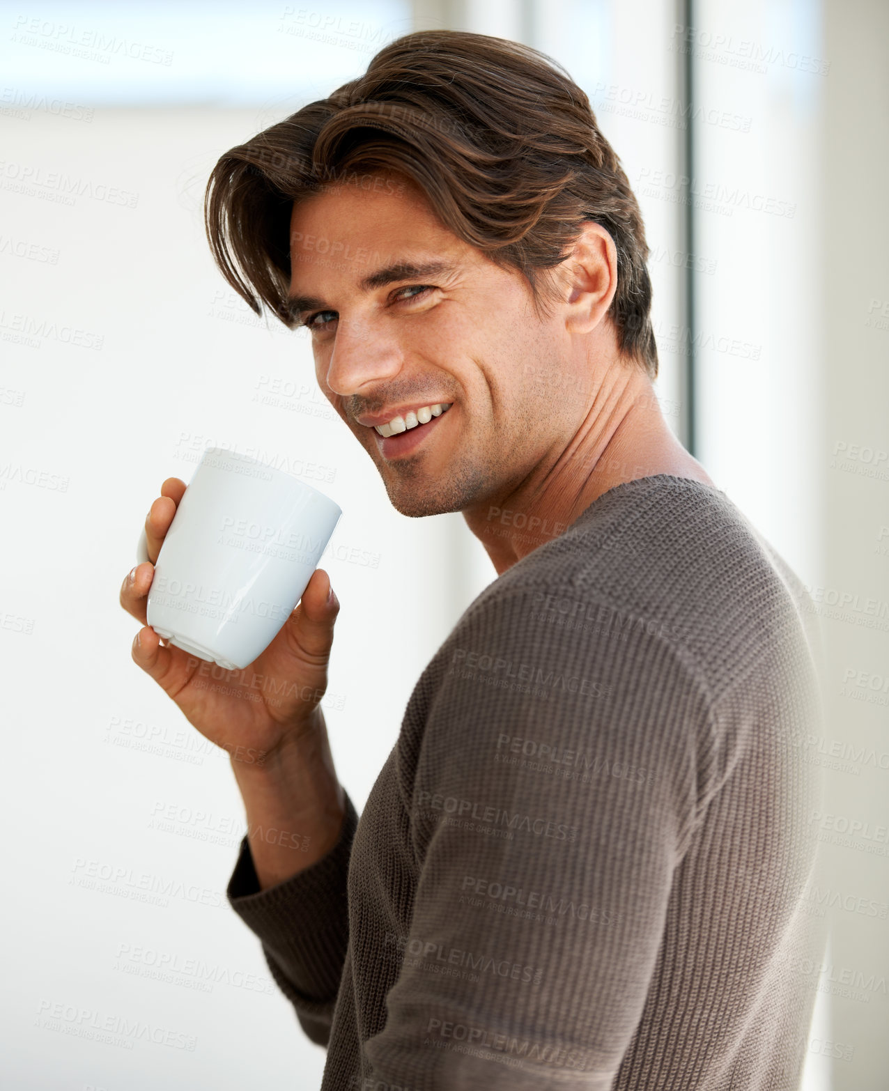 Buy stock photo Portrait, happy and man with coffee in home for breakfast, warm beverage and relax in morning. Handsome guy smile with mug to enjoy drinking fresh caffeine, cappuccino and hot espresso in apartment 