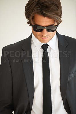 Buy stock photo Business, attitude and confident man in office with glasses, attitude or empowered on wall background. Leader, mindset and cool male entrepreneur thinking, edgy and posing with leadership or focus