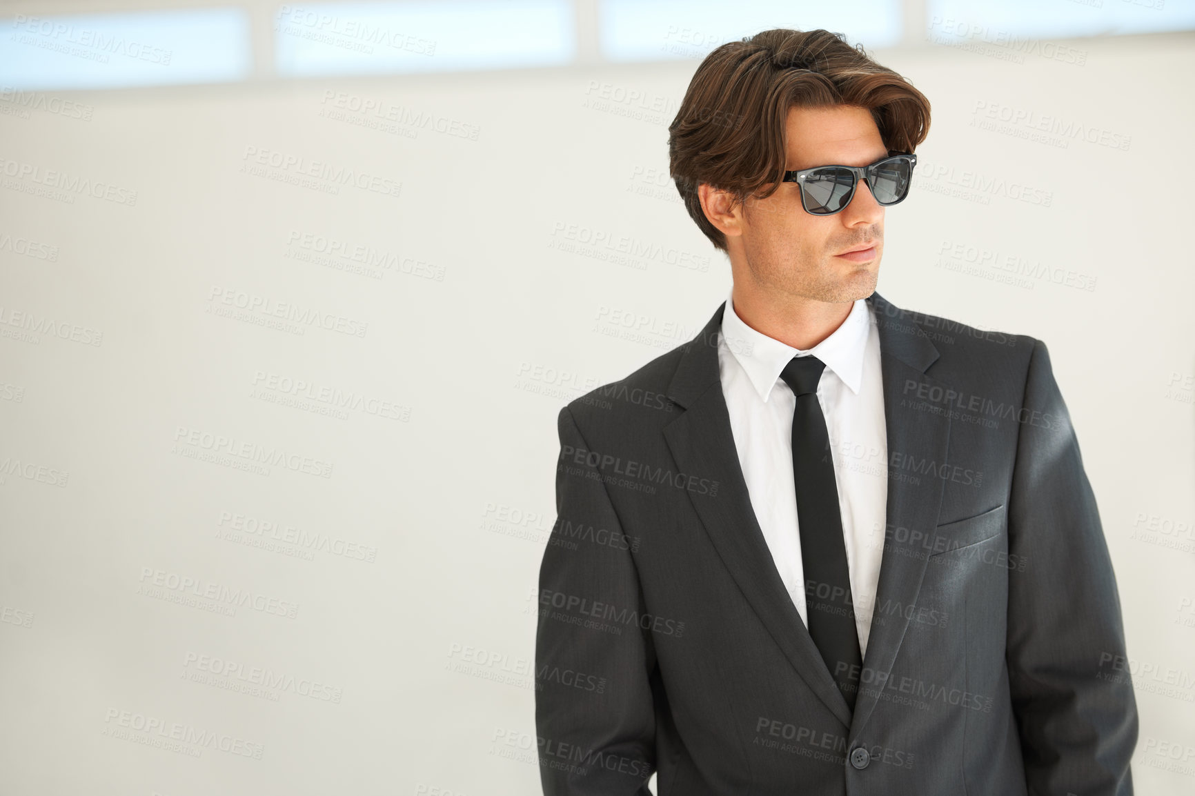 Buy stock photo Confidence, attitude and business man in office with glasses, attitude or empowered on wall background. Leader, mindset and cool male entrepreneur thinking, edgy and posing with leadership or focus