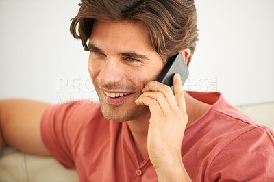 Buy stock photo Man, smile and phone call to contact in home for social networking, mobile communication and cellphone in living room. Face, happy guy and and talking on smartphone for chat, conversation and hello