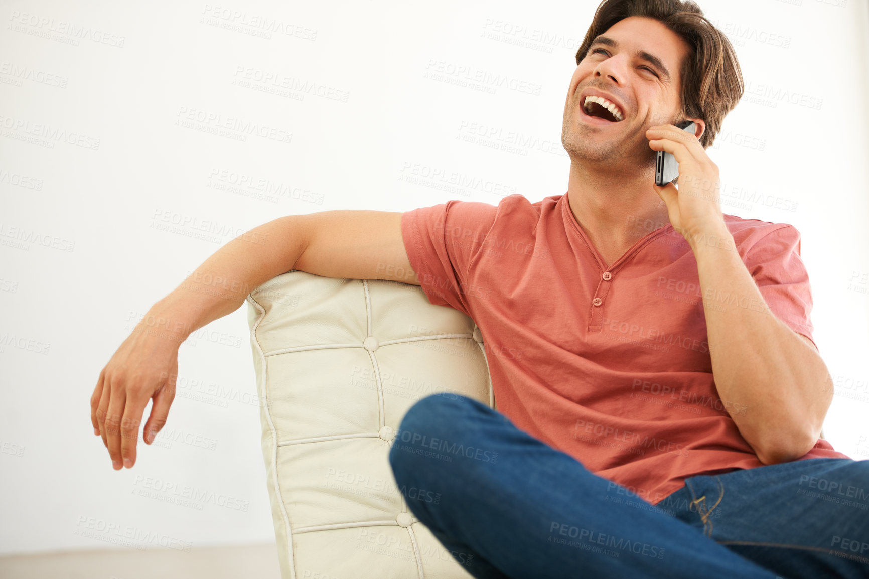 Buy stock photo Man, funny conversation and phone call, relax at home with laughter, happiness and communication. Network, connectivity and mobile chat with comedy, technology and talking, crazy story and humor