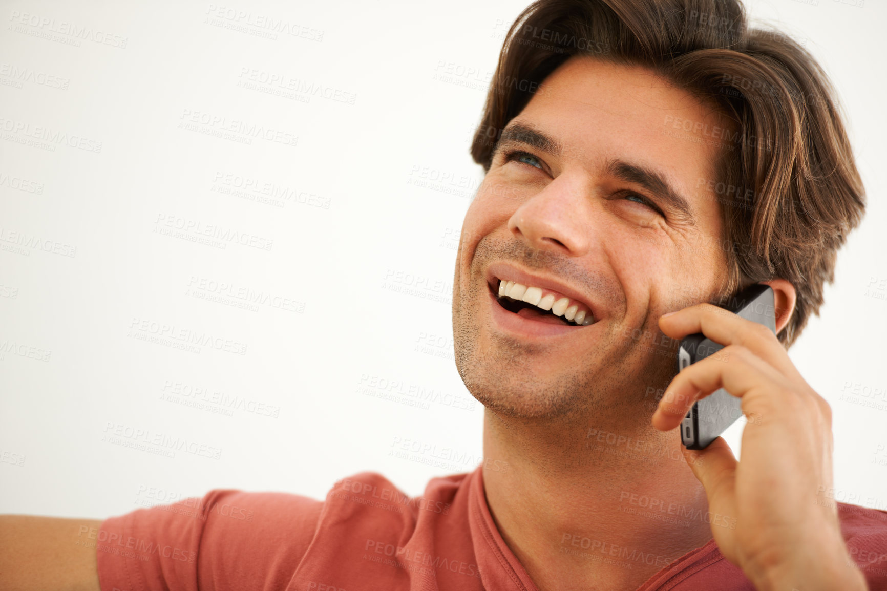 Buy stock photo Happy, man and thinking in home with phone call, mobile contact and digital communication with mockup space. Face, laughing and talking on smartphone for chat, funny conversation and tech connection 