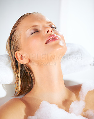 Buy stock photo Relax, woman and bubble bath with cleaning, skincare and shampoo beauty treatment in water. Wellness, morning and home of a female person with soap in a bathroom for hair wash and calm with foam