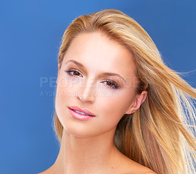 Buy stock photo Beauty, skincare and portrait of woman on blue background for wellness, facial treatment and cosmetics. Dermatology, spa and face of person for salon, natural skin and luxury aesthetic in studio