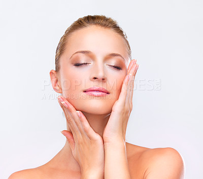 Buy stock photo Woman, makeup and touch face for beauty, skincare treatment and salon glow in studio on white background. Model, facial wellness and healthy benefits for dermatology, cosmetics and aesthetic shine
