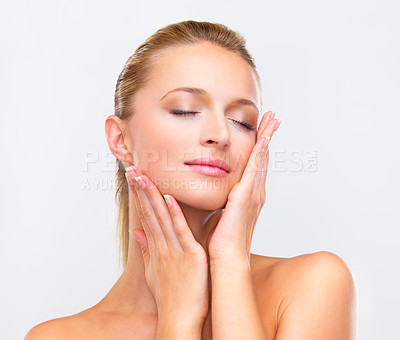 Buy stock photo Woman, beauty and touch face for skincare, salon treatment and makeup glow in studio on white background. Model, eyes closed and wellness for facial dermatology, cosmetics and healthy aesthetic shine