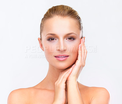 Buy stock photo Portrait of a beautiful blonde woman with flawless skin gazing at you, isolated on white