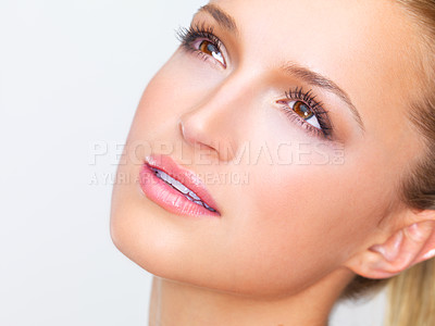 Buy stock photo Thinking, beauty and woman with makeup on a studio background for skincare and wellness. Young, idea and a model or girl with a dream of cosmetics, grooming or health of facial skin with dermatology